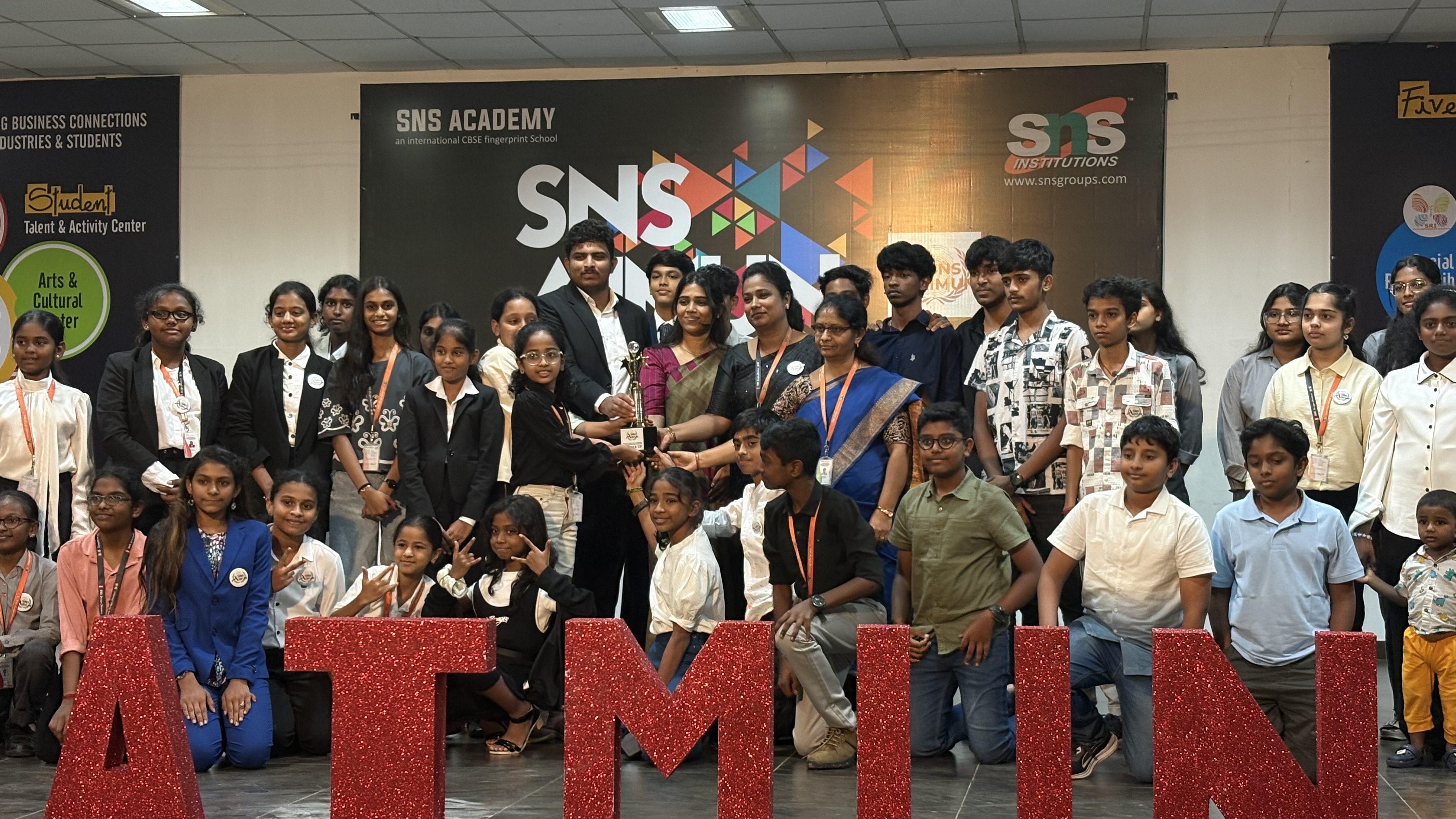 SNS AIMUN delegates posing together with the event letters